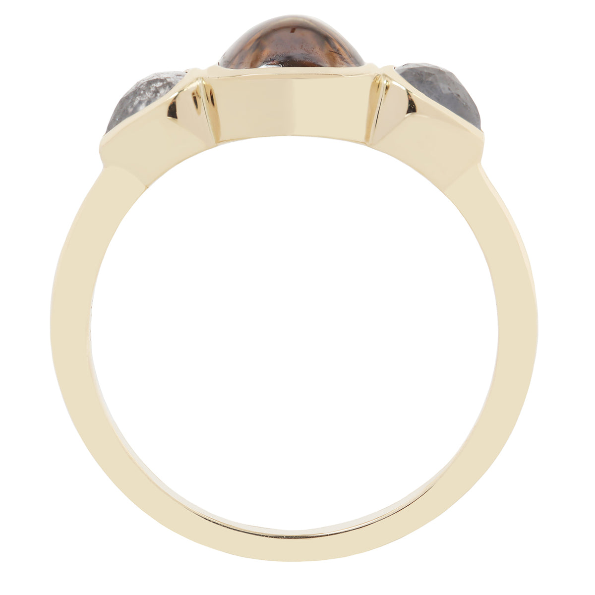 Gold ring with three stones on a white background