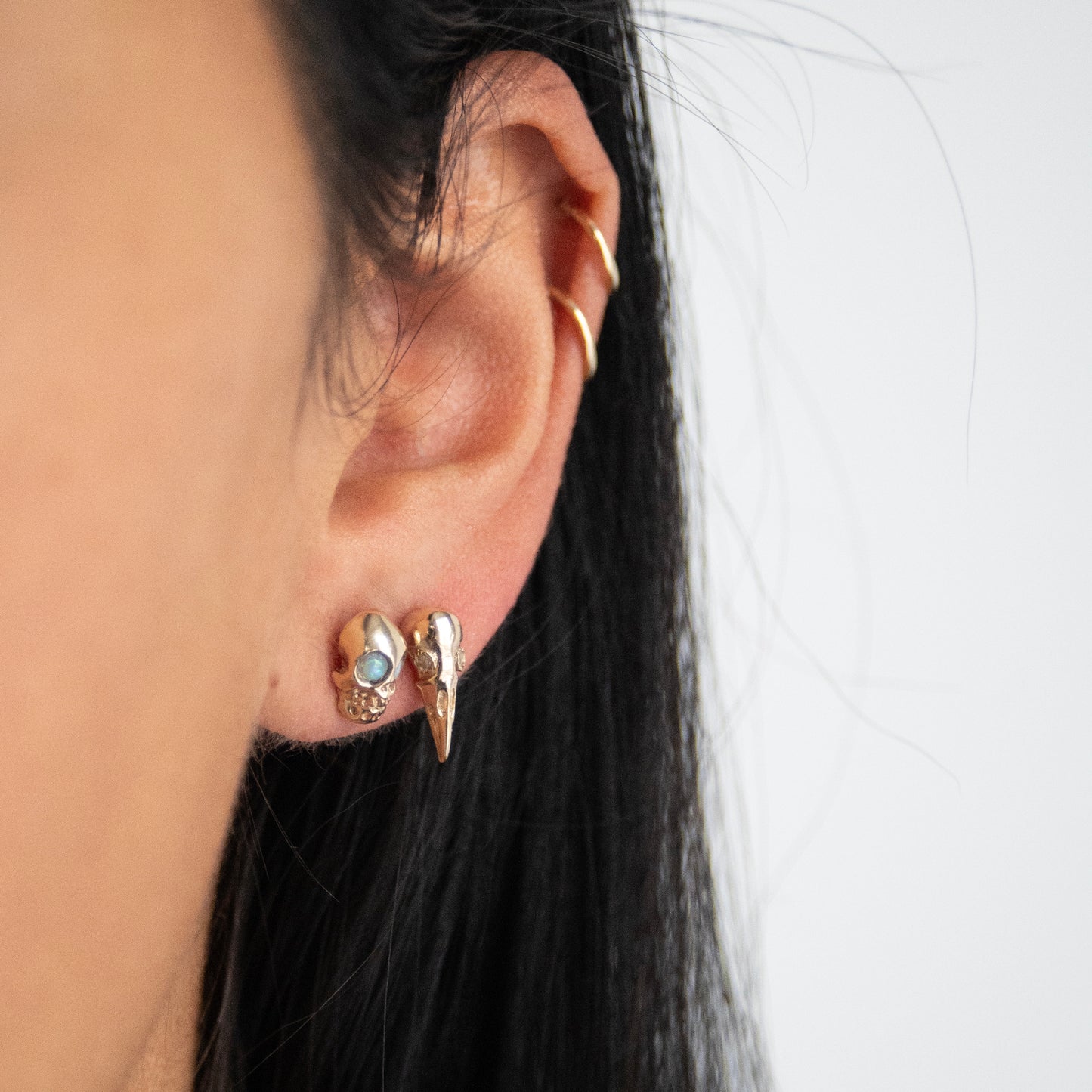Opal Eyed Gold Skull Studs