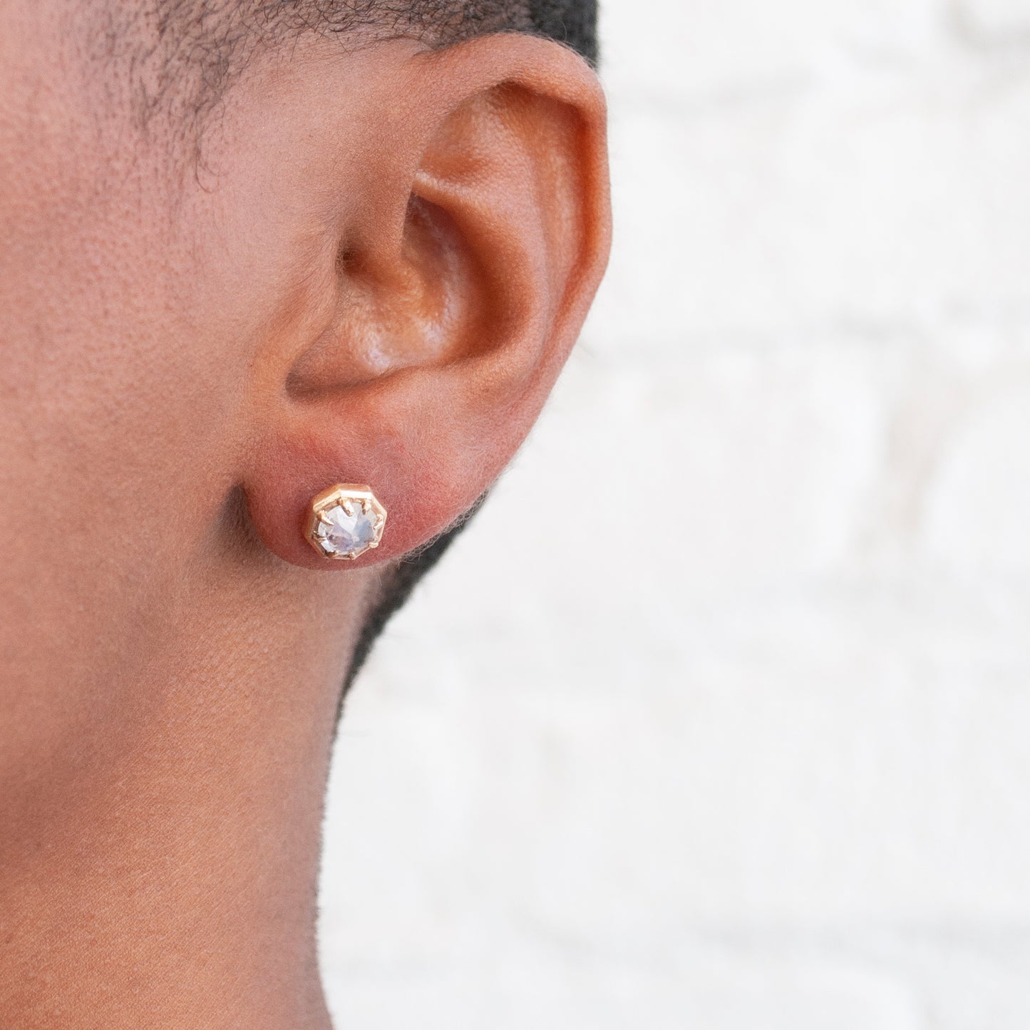 Lauren Wolf Yellow Gold Rainbow Moonstone Studs on model's ear