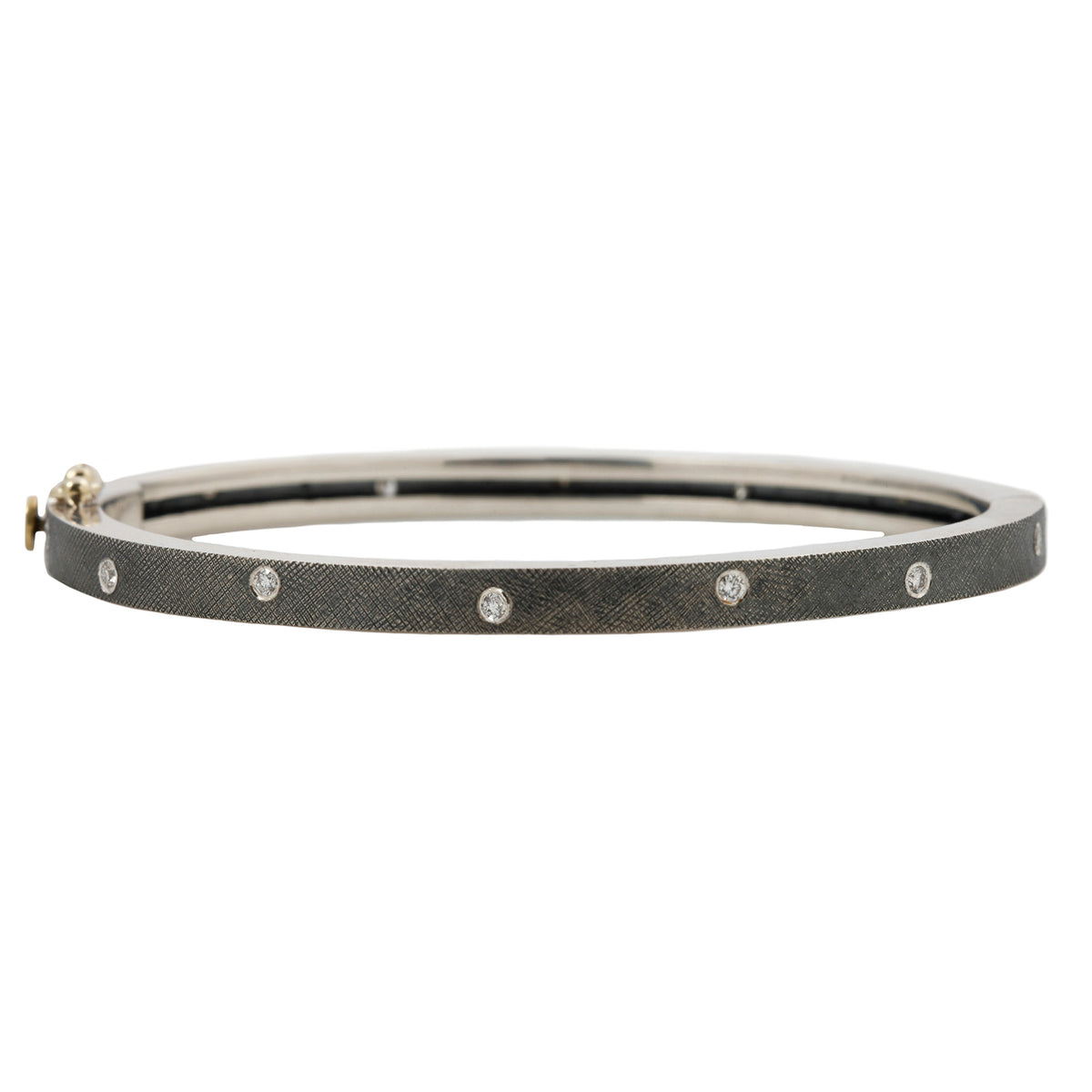 Rene Escobar - Silver bracelet with small diamonds on a white background