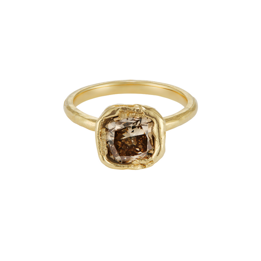 Silver ring with a champagne gemstone on a white background