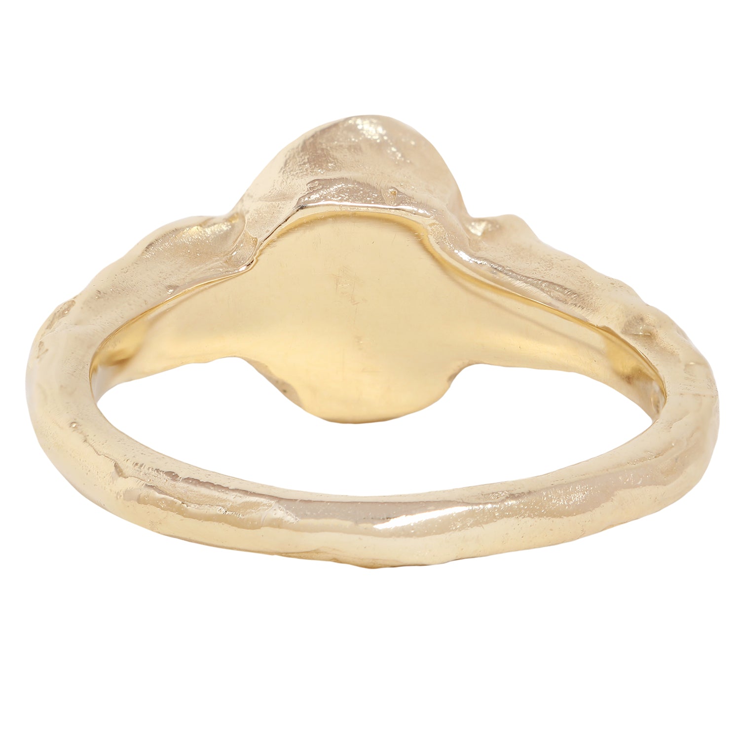 A yellow gold ring featuring a large oval-cut clear center stone and two baguette-cut side stones, shown on a plain white background.