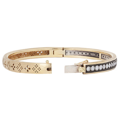 The Diamond & Clover Bangle in gold bangle with diamond accents showing clasp on a white background