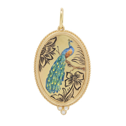 Gold pendant with peacock design on a white background