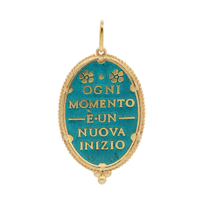 Gold and blue pendant with Italian inscription on a white background