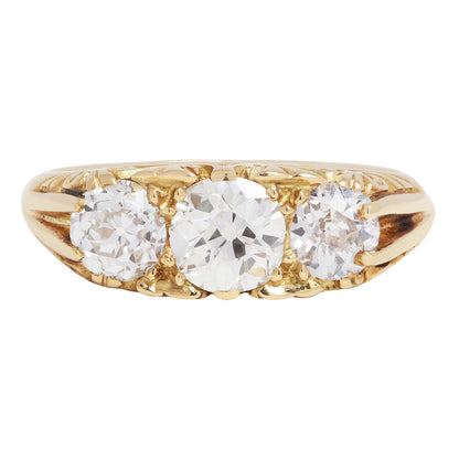 antique old ring with three diamonds on a white background