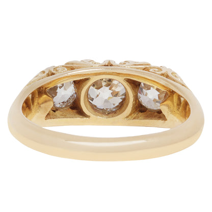 antique old ring with three diamonds on a white background