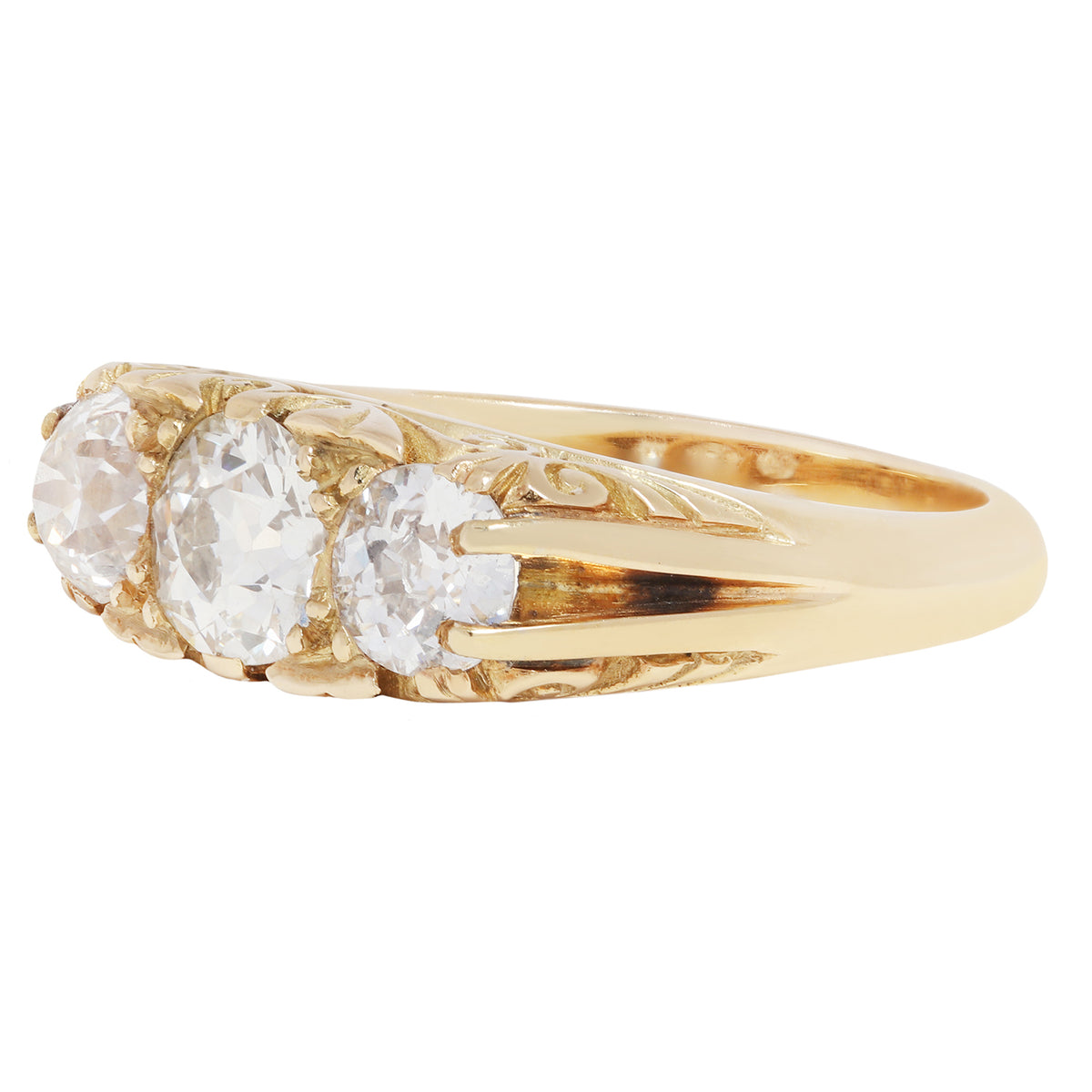 antique old ring with three diamonds on a white background