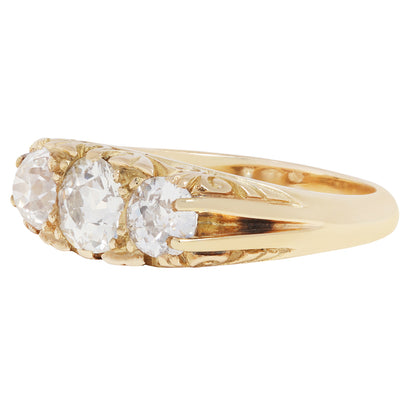 antique old ring with three diamonds on a white background