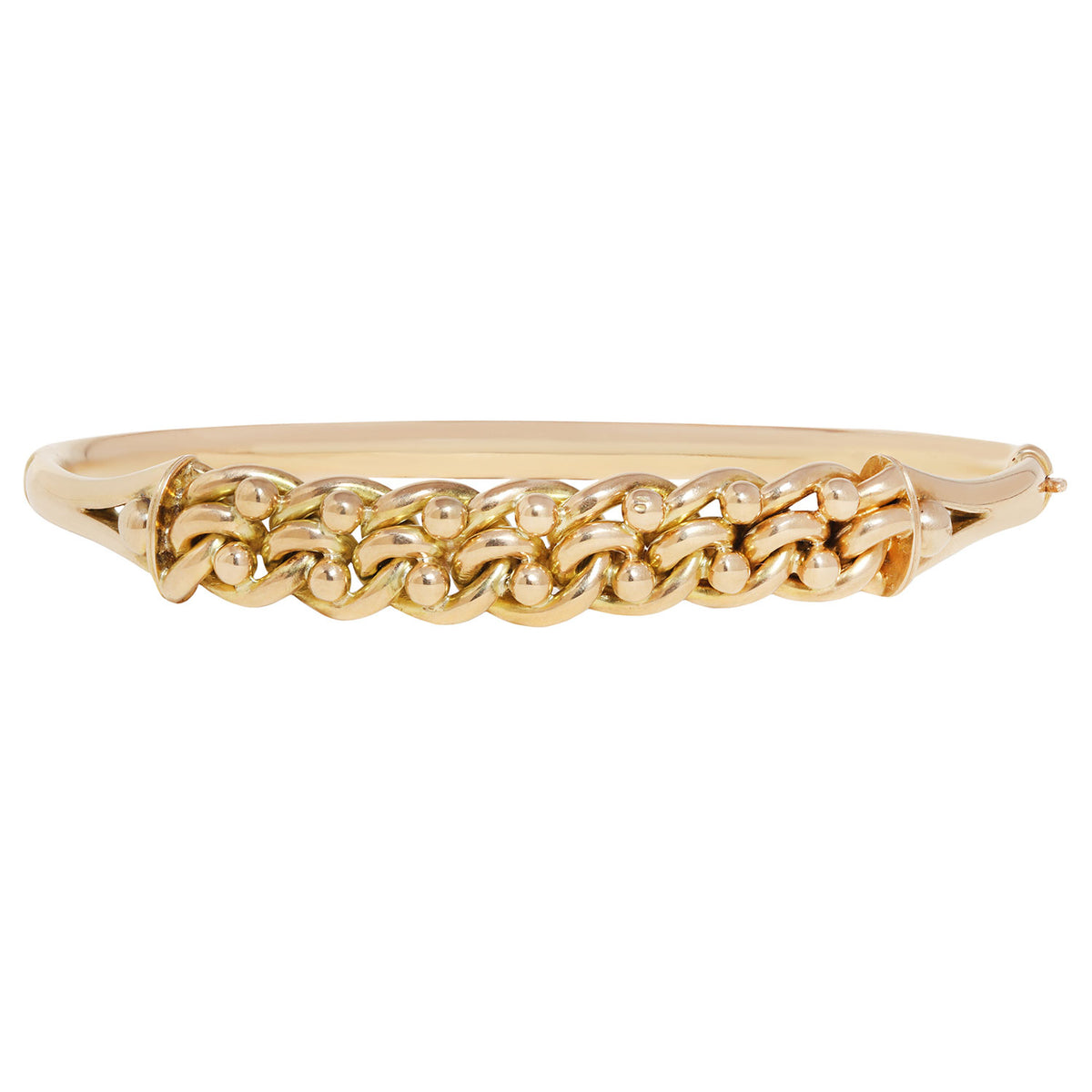 A gold bangle bracelet featuring a raised, textured chain-link pattern across the front, set against a plain white background.
