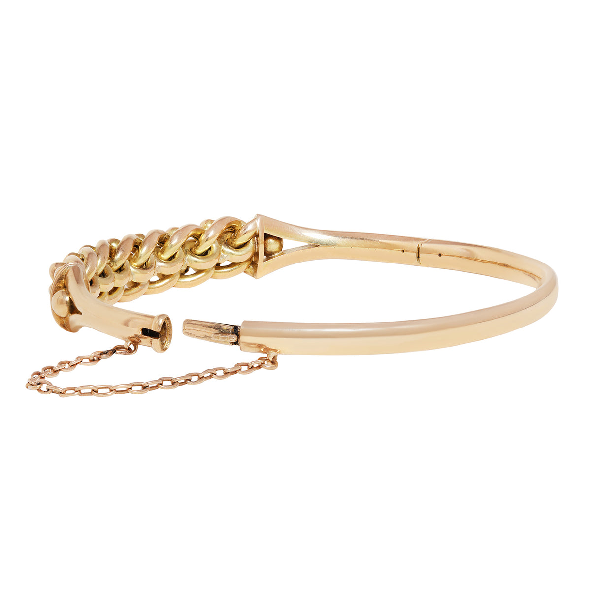 A gold-toned metal bangle bracelet featuring a textured, woven chain-like segment on one side and a smooth, polished band on the other, with a short matching chain attached.