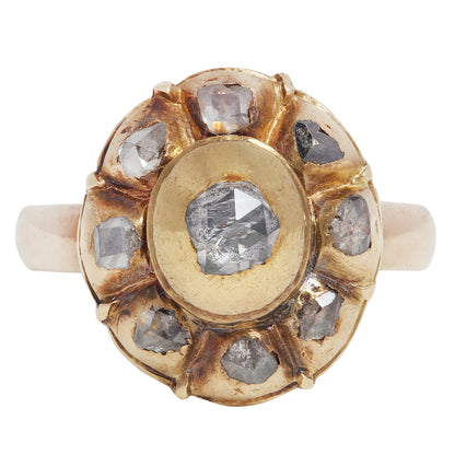 antique gold ring with embedded diamonds on a white background