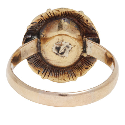 antique gold ring with embedded diamonds on a white background