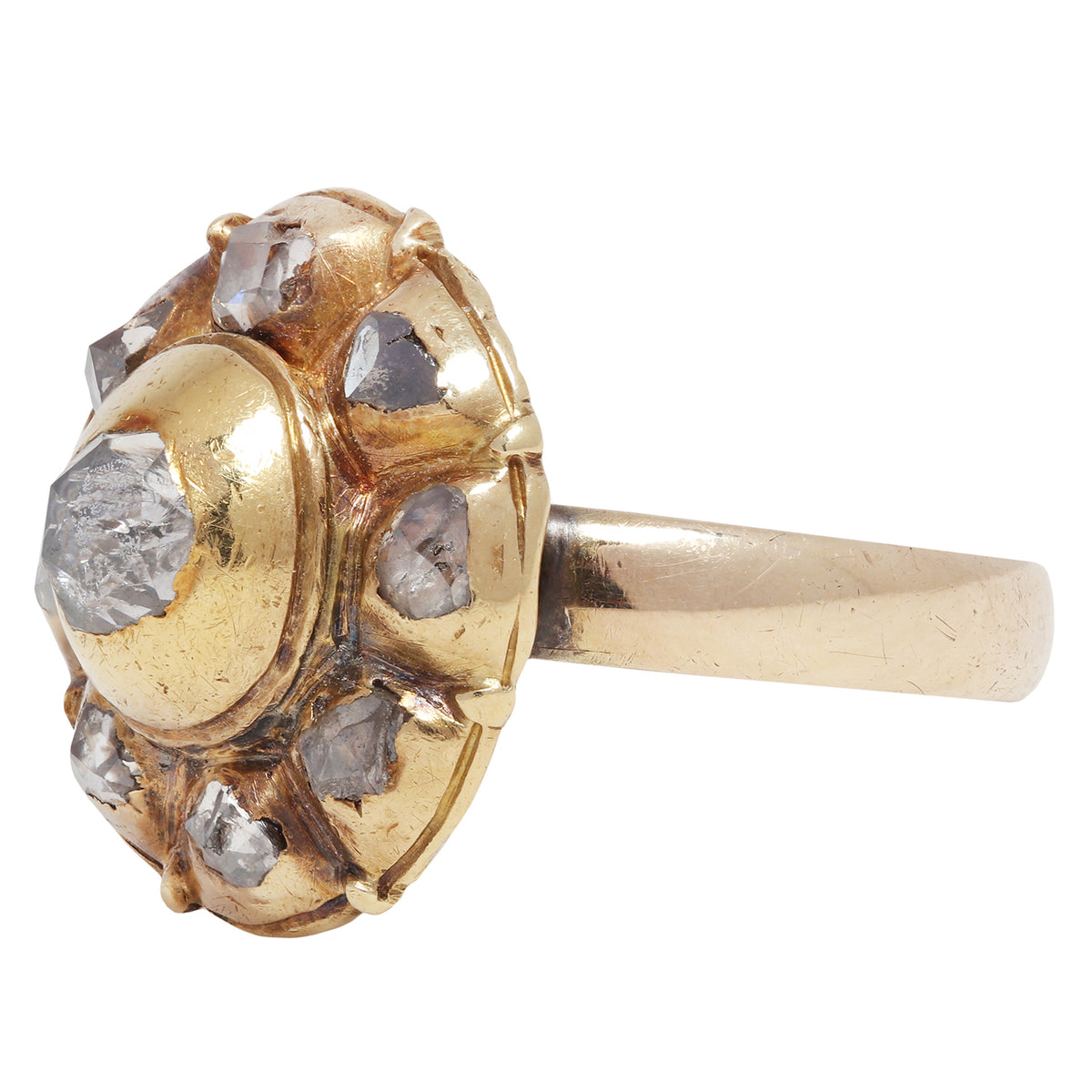 antique gold ring with embedded diamonds on a white background