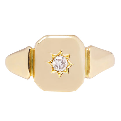Antique - Gold ring with a diamond in the center on a white background