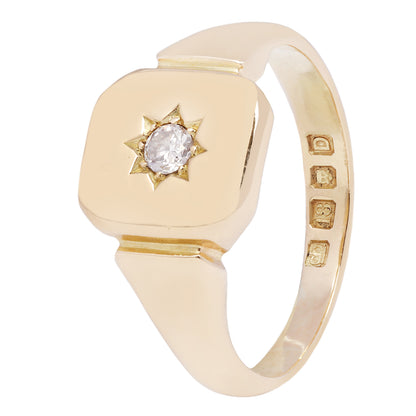 Antique - Gold ring with a diamond and star design on a white background