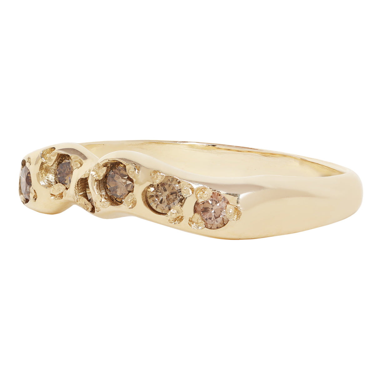 A yellow gold ring featuring five small, round-cut brown gemstones set along the band, shown against a plain white background.