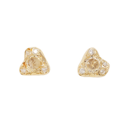 gold and topaz earrings on a white background