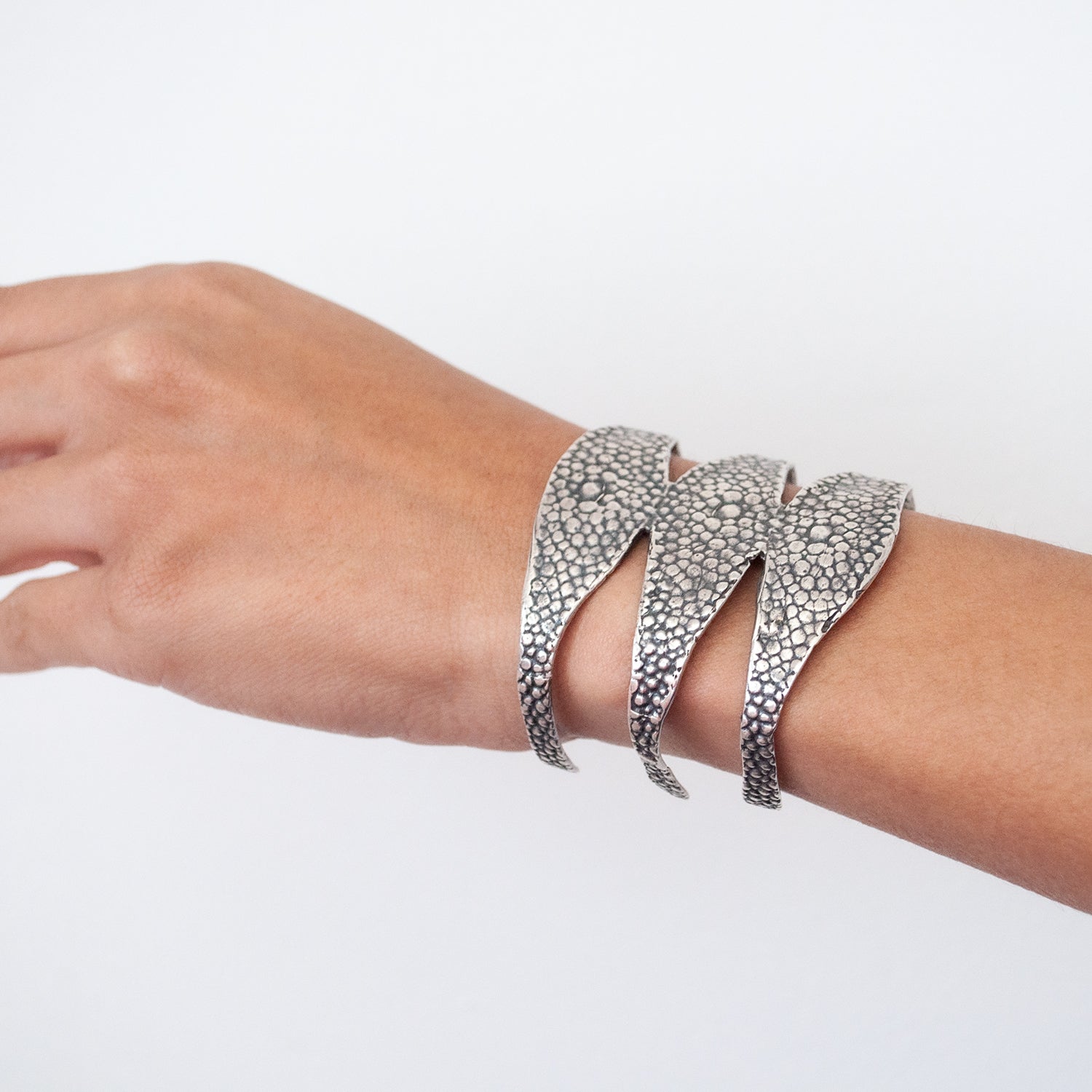 Stingray Triple Cuff by Lauren Wolf Jewelry shown worn on the wrist