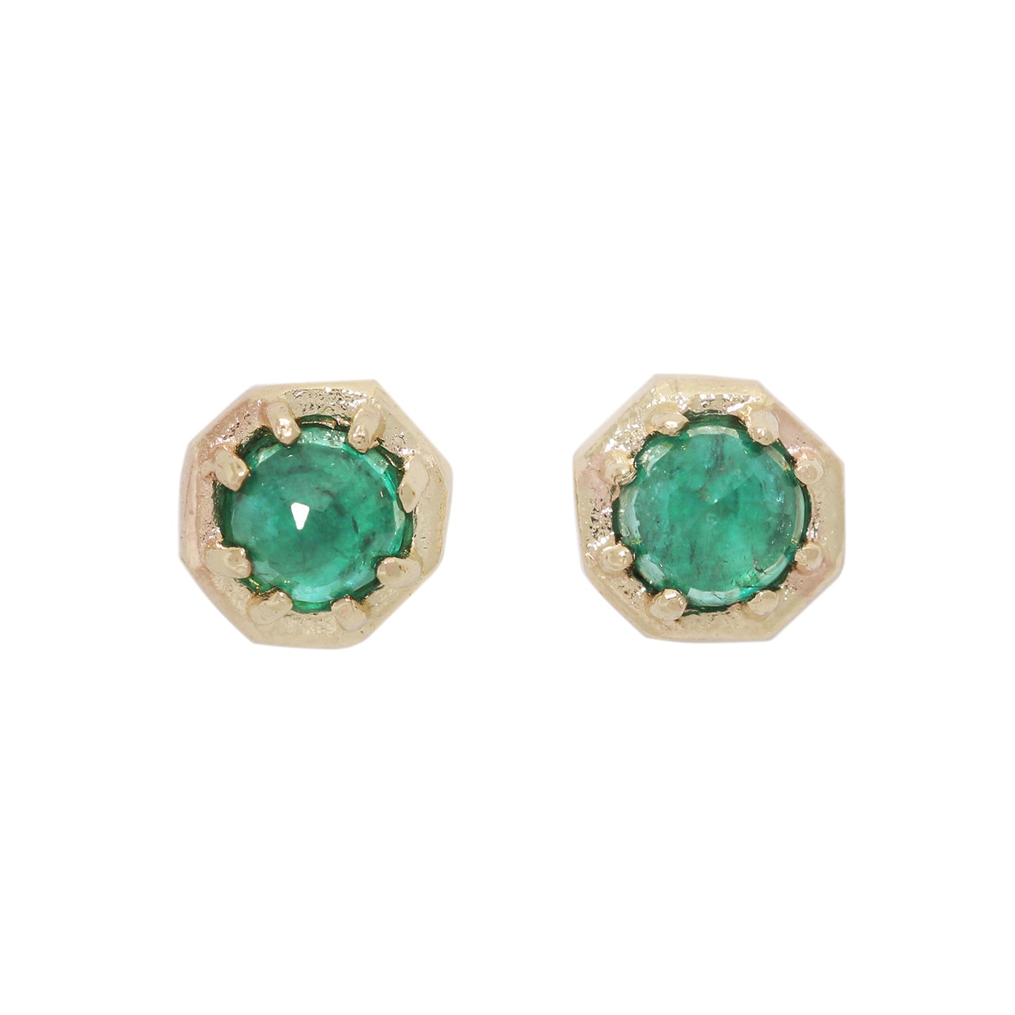 Pair of gold earrings with green gemstones on a white background