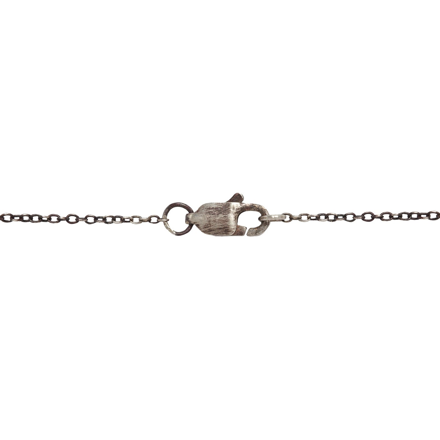 The oxidized silver clasp on Lauren Wolf's Morganite Necklace against a white backdrop