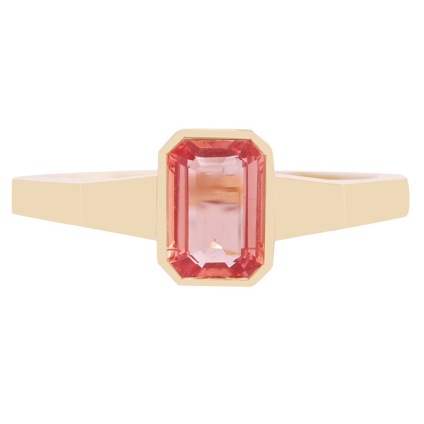 Gold ring with a pink gemstone on a white background