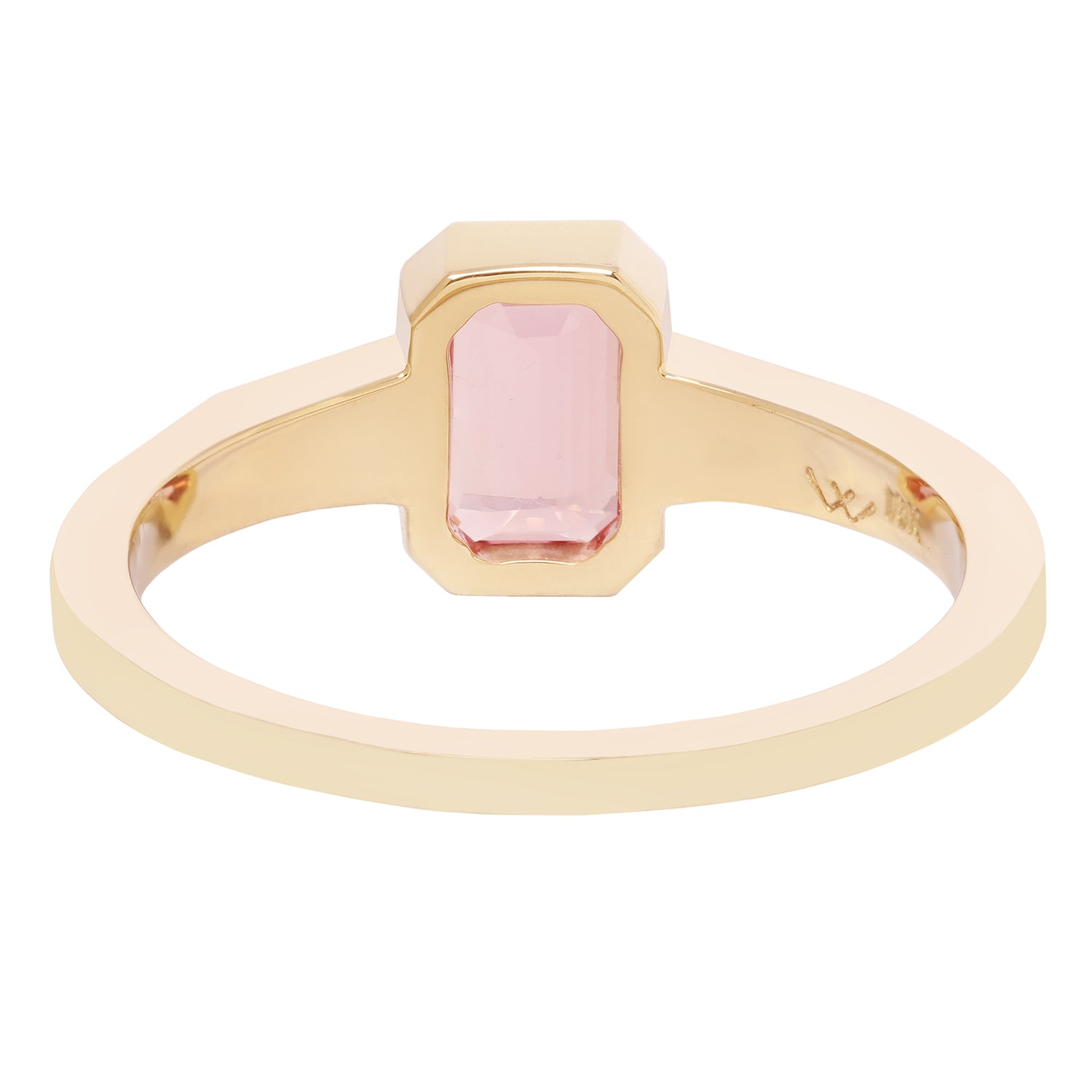Gold ring with a pink gemstone on a white background