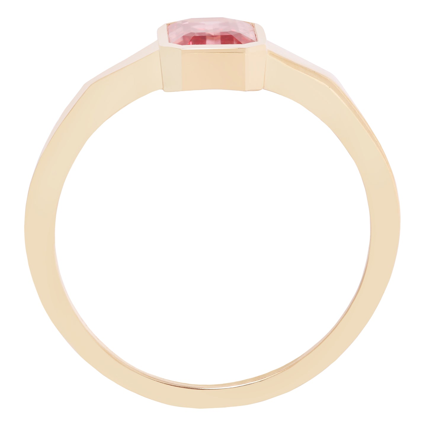 Gold ring with a pink gemstone on a white background