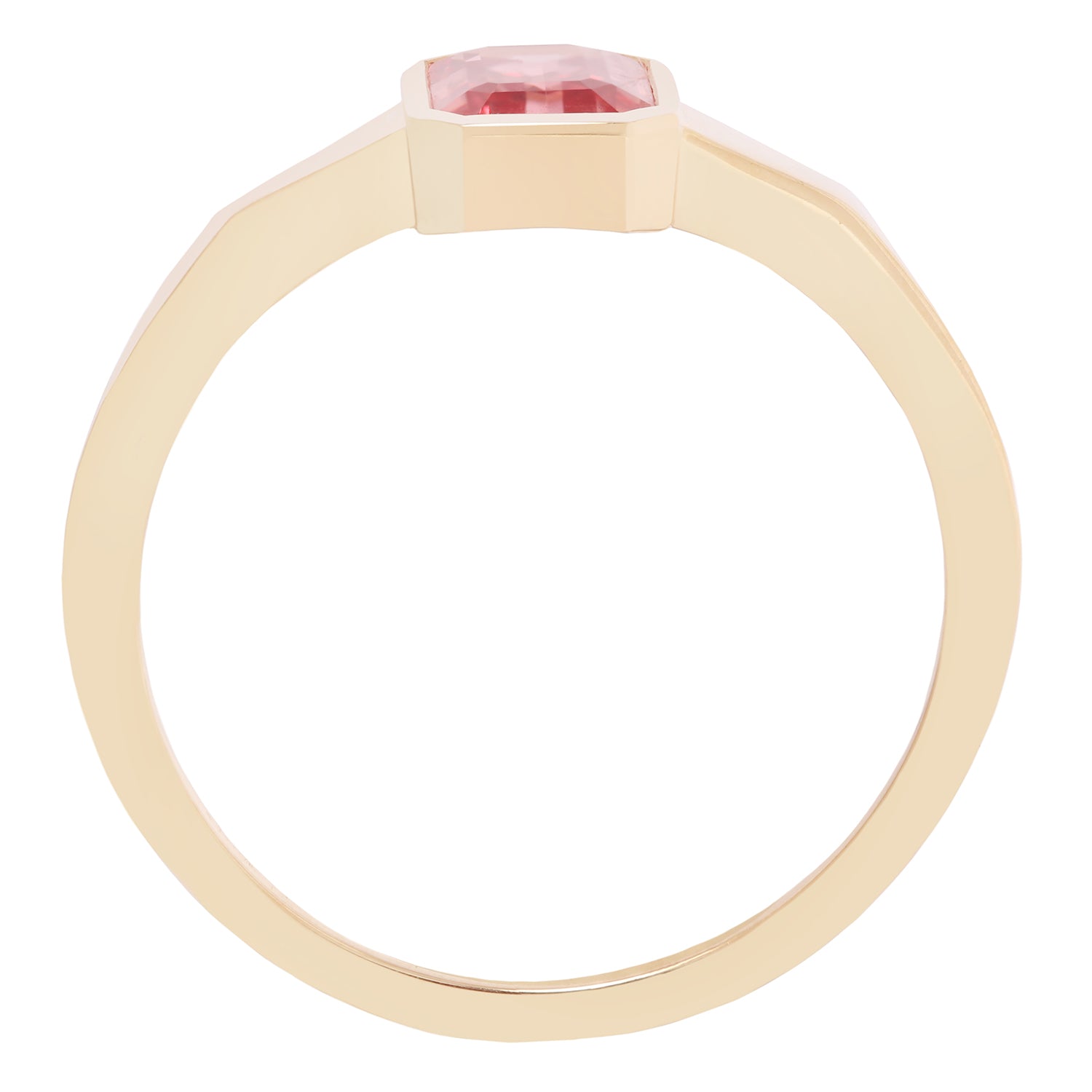 Gold ring with a pink gemstone on a white background