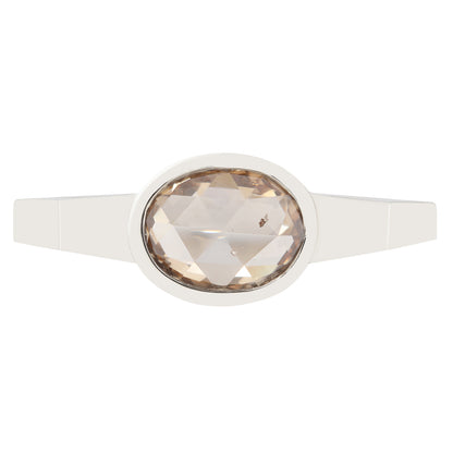 Ring with a large faceted gemstone on a white background