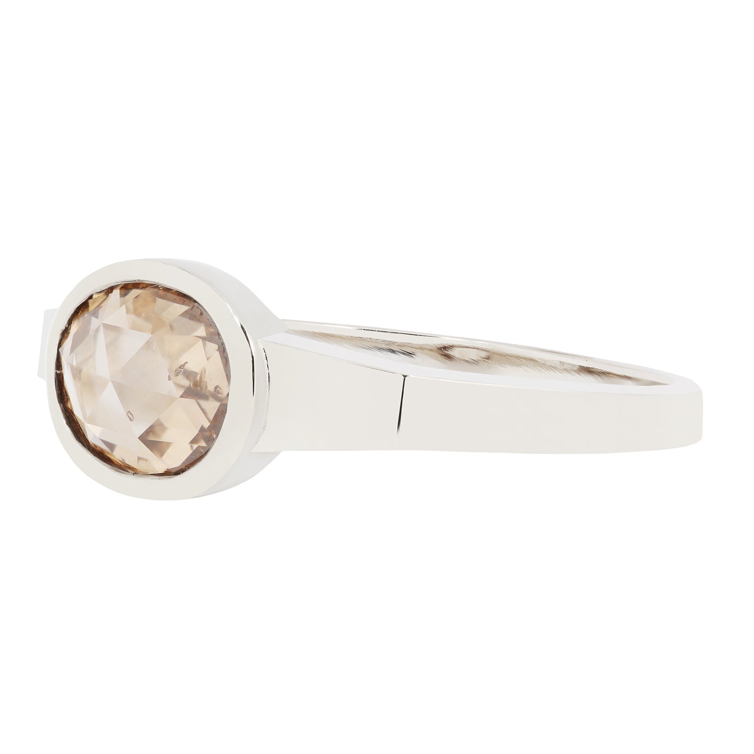 White Gold ring with a round, brown gemstone on a white background