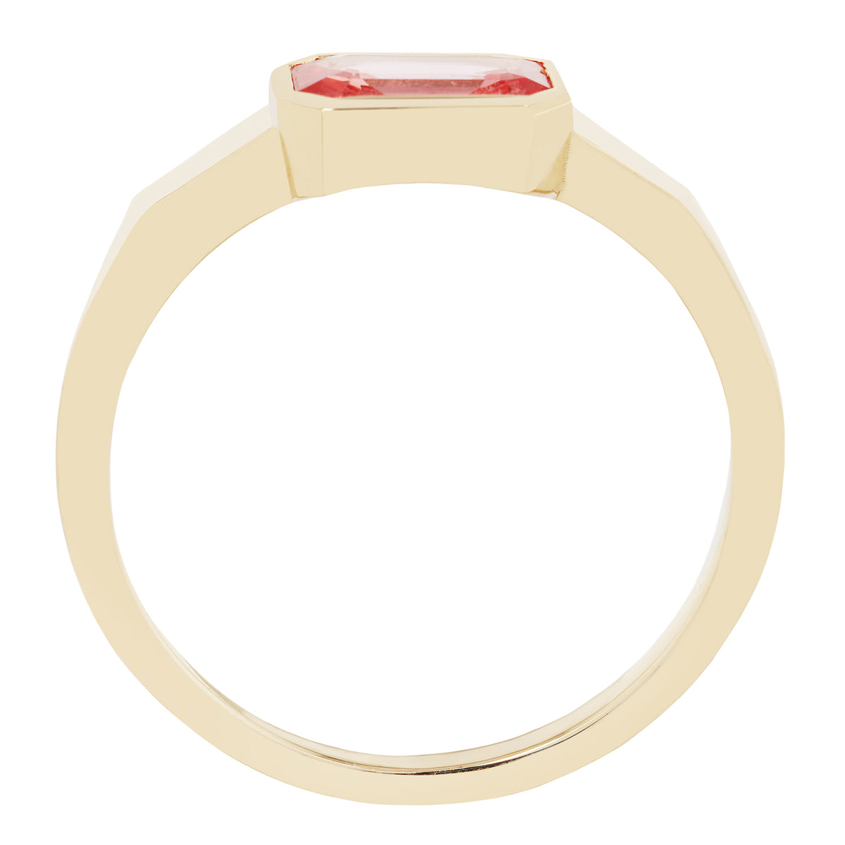Gold ring with a pink gemstone on a white background