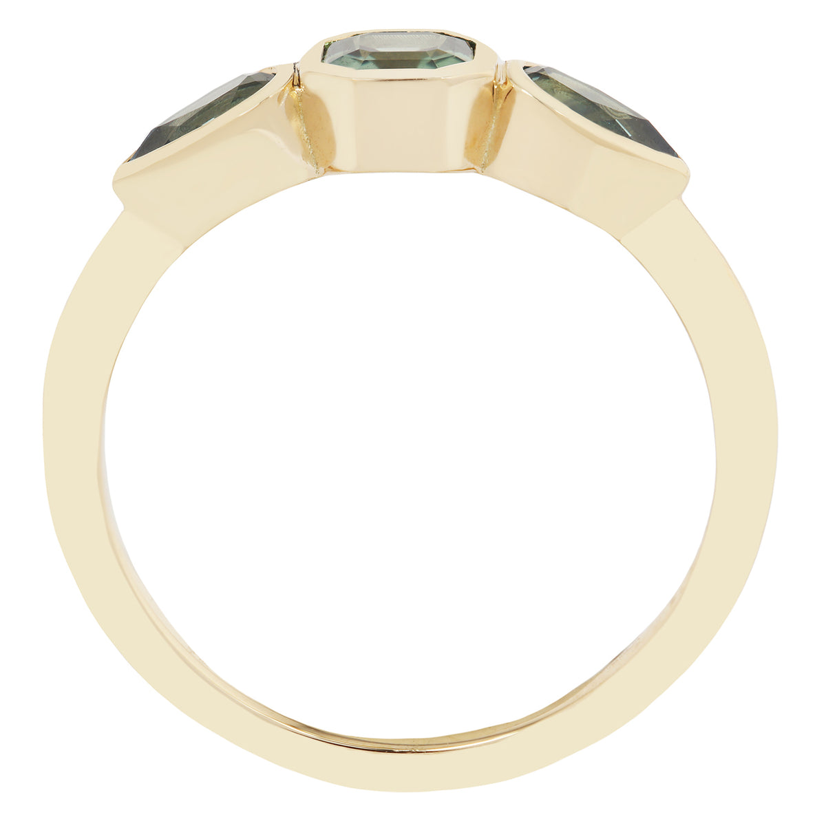 Gold ring with green gemstones on a white background