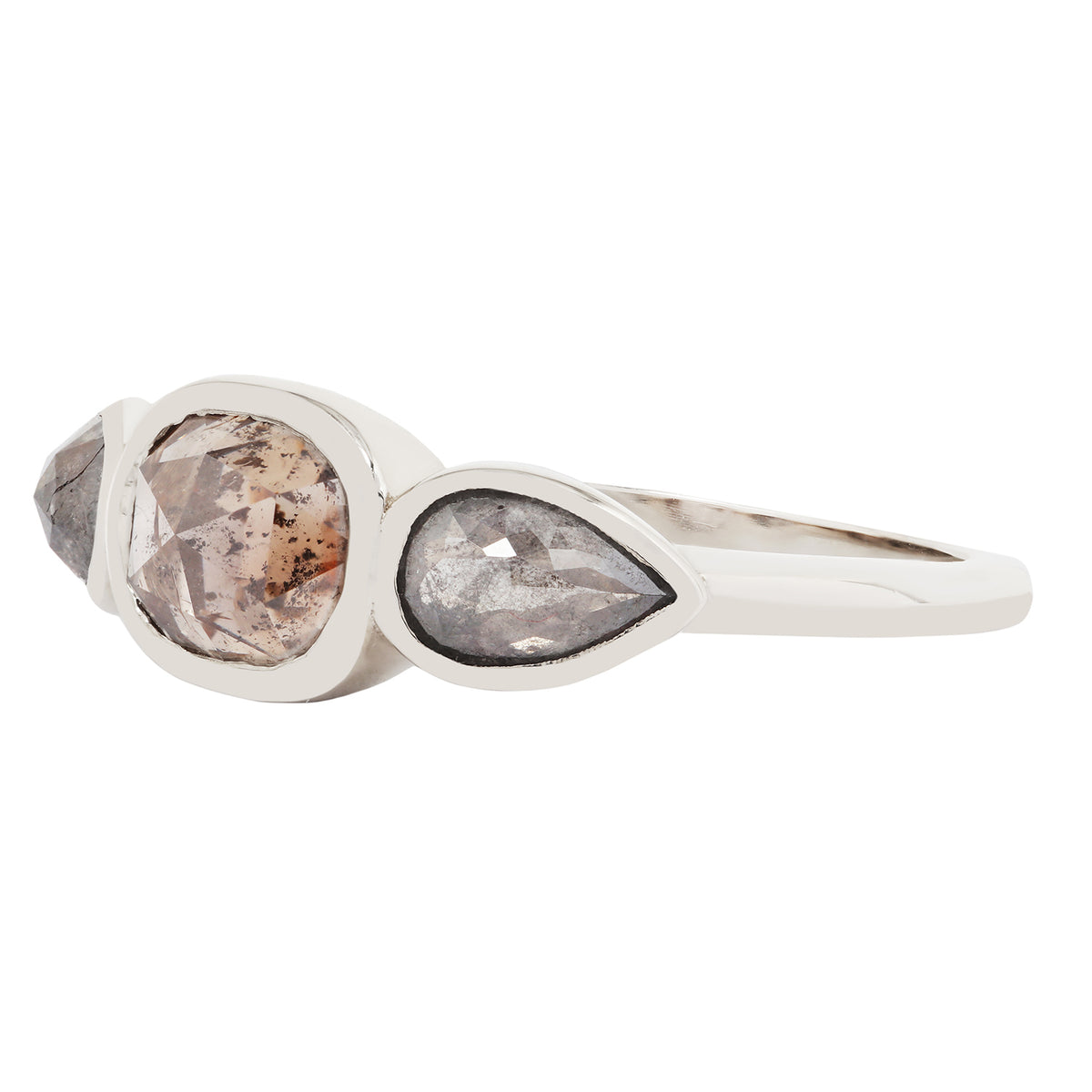 White gold ring with two pear-shaped gemstones on a white background