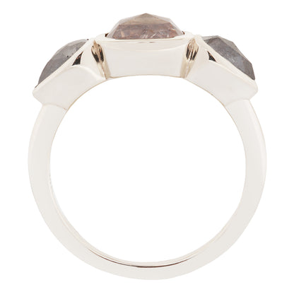 White gold ring with gray gemstones on a white background