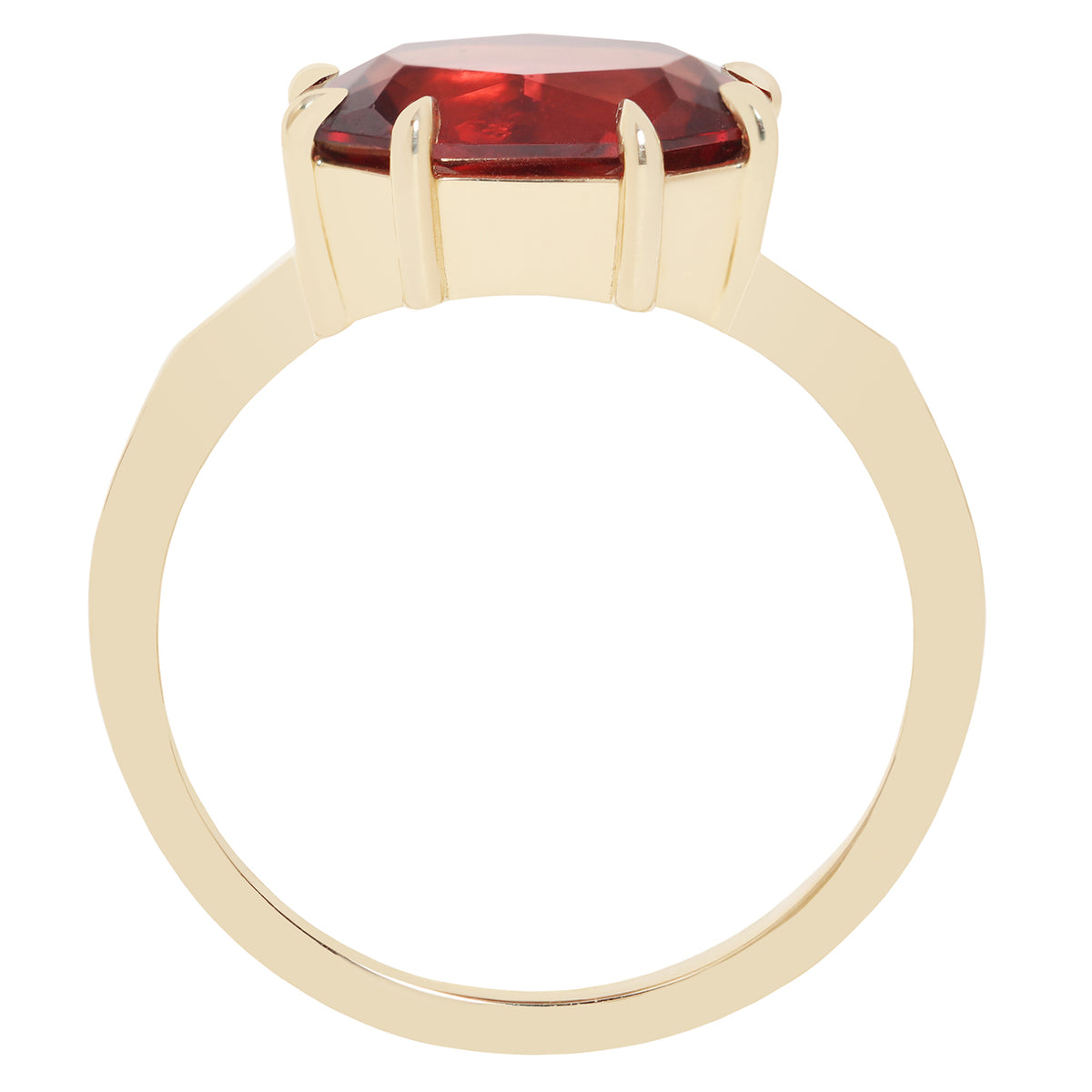 A gold ring featuring a large, faceted red gemstone in a prong setting, shown against a plain white background.