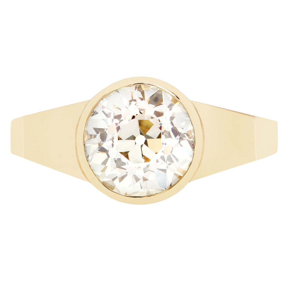 Gold ring with a large diamond on a white background