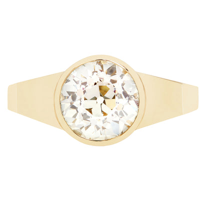 Gold ring with a large diamond on a white background