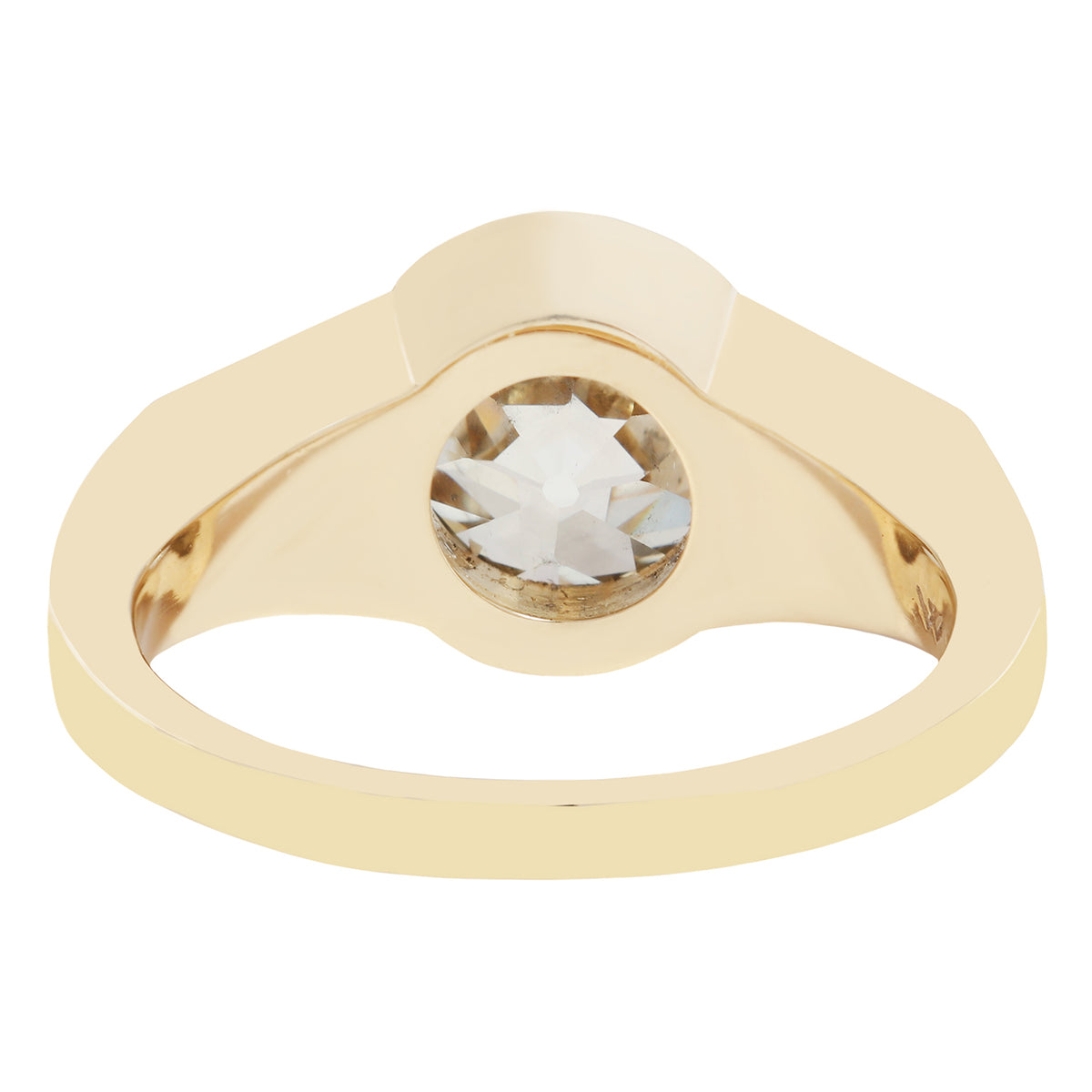 Gold ring with a large diamond on a white background