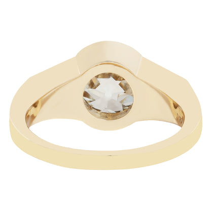Gold ring with a large diamond on a white background