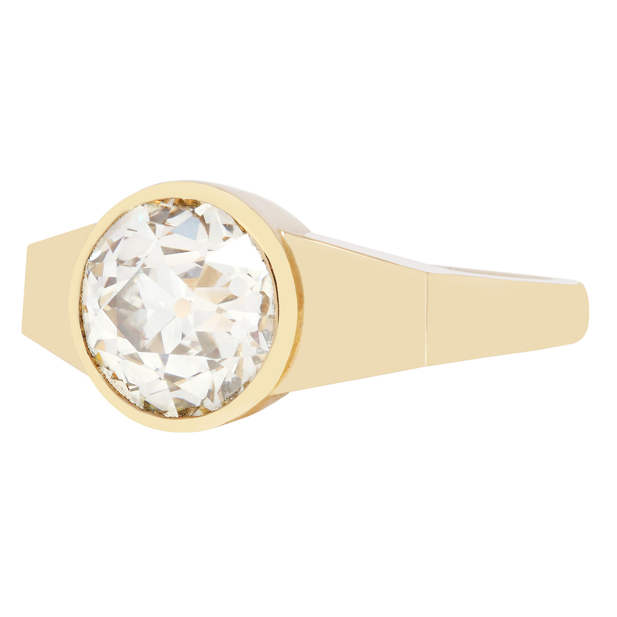 Gold ring with a large diamond on a white background