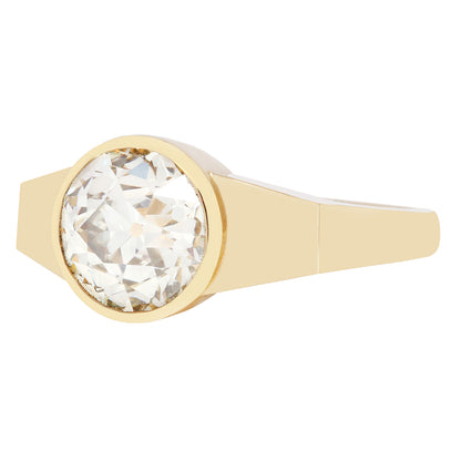 Gold ring with a large diamond on a white background