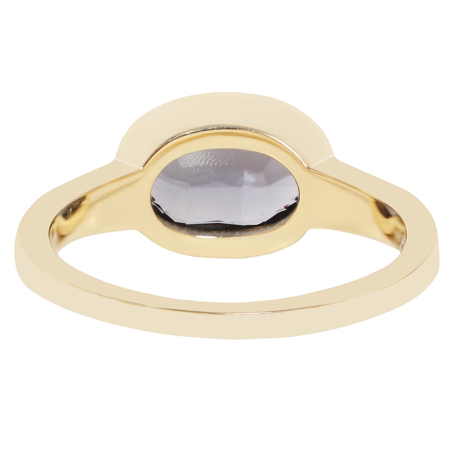 A gold signet-style ring with a smooth, polished band and a semi-circular bezel holding a dark gray oval gemstone, shown against a plain white background.