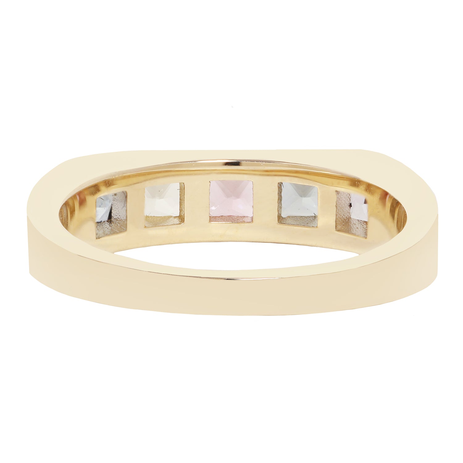 A gold ring with five square-cut gemstones set in a row on the inside, shown against a plain white background.