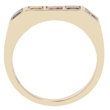 A gold ring with a wide, rounded band and a top setting featuring three small rectangular gemstones in different colors, shown against a plain white background.