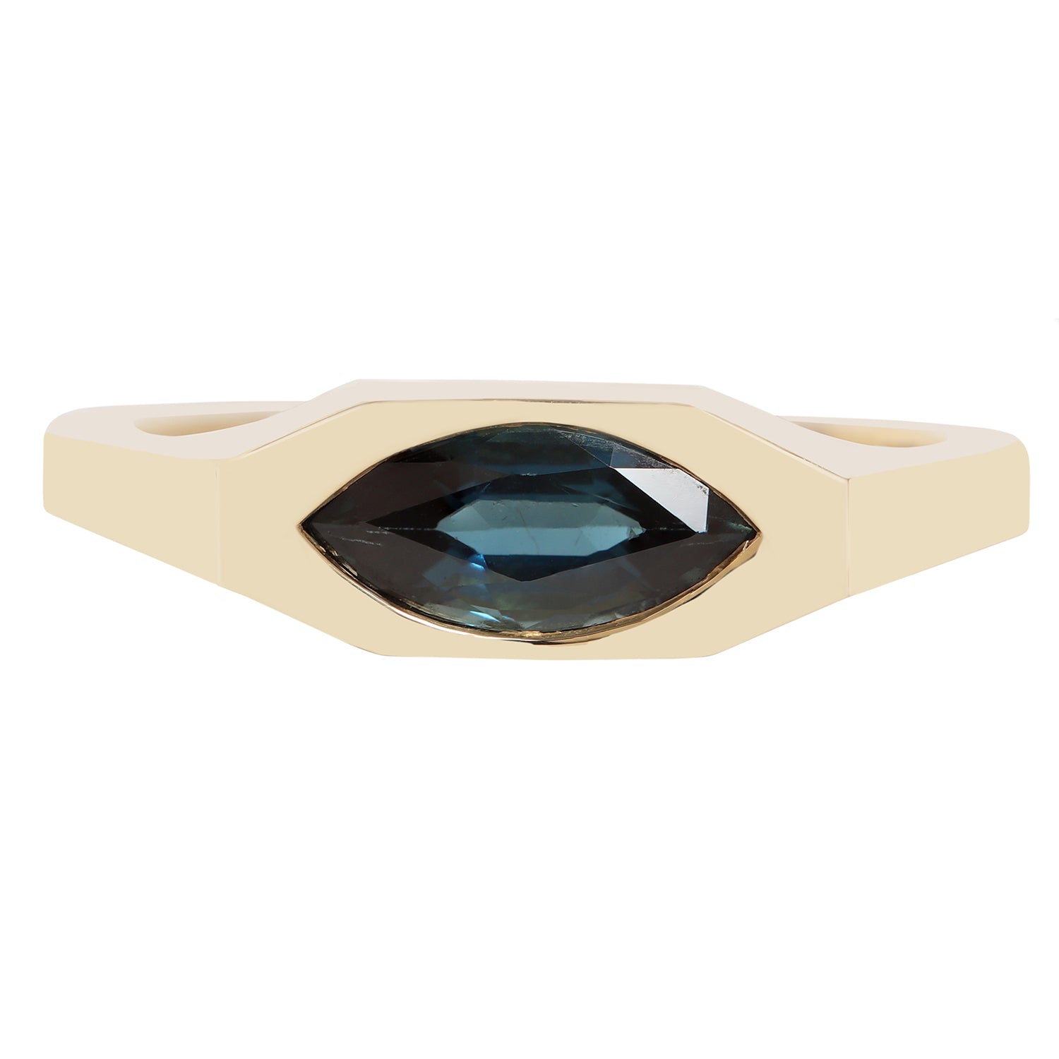 A modern geometric ring featuring a faceted marquise-cut dark blue gemstone in a bezel setting on a matte cream-colored band, shown against a plain white background.