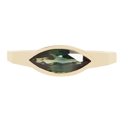 A gold ring featuring a marquise-cut green gemstone in a bezel setting, shown against a plain white background.