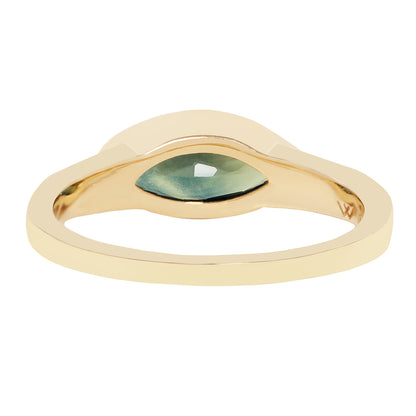 A gold ring with a curved, cloud-like setting holding a marquise-cut green gemstone, shown against a plain white background.
