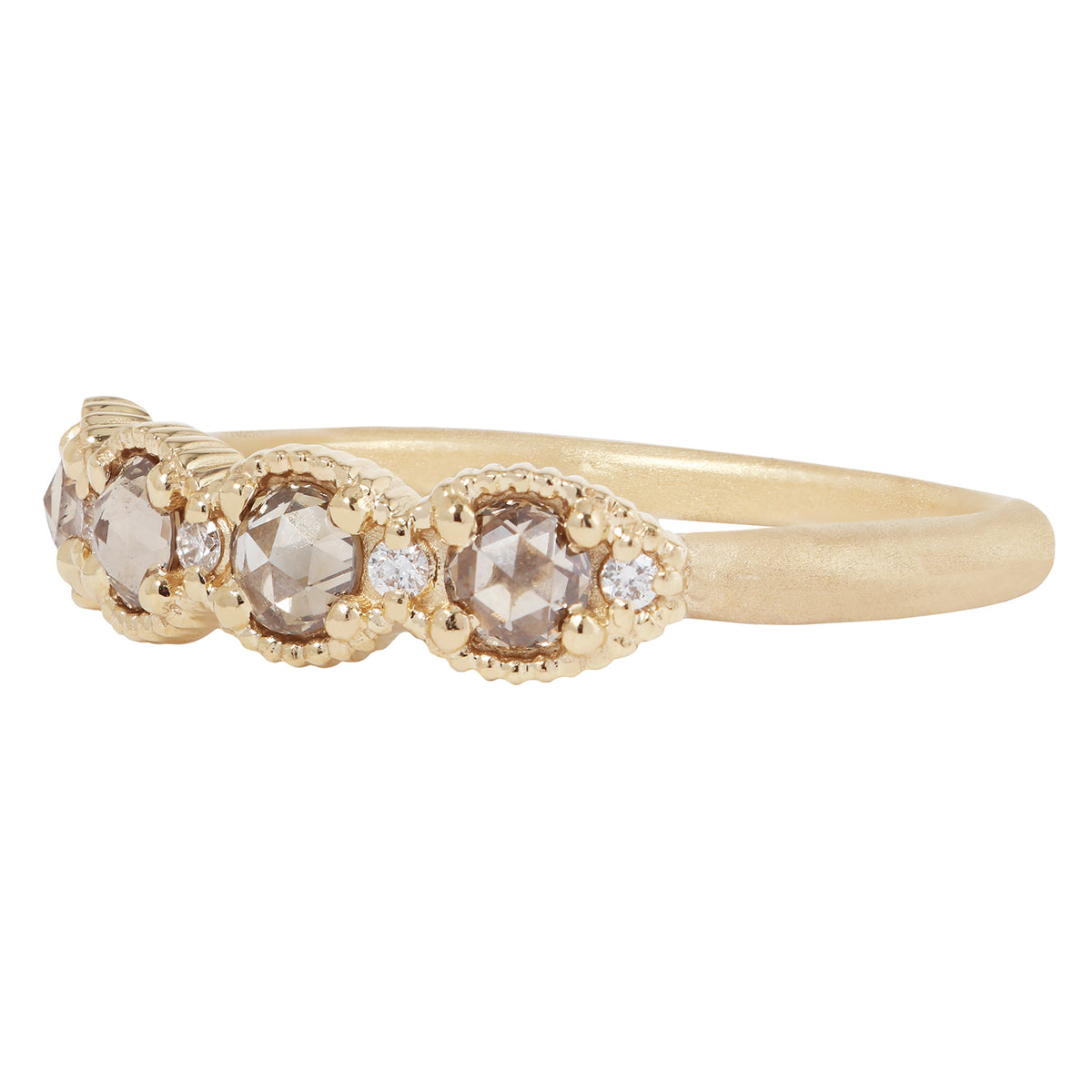 Gold ring with diamond stones on a white background