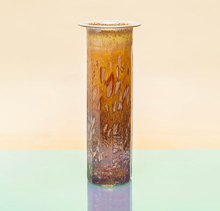 Tall cylindrical blown glass with texture vase on a gradient background